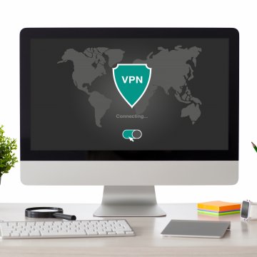 computer on desk vpn services netflix watching keyboard pencils 